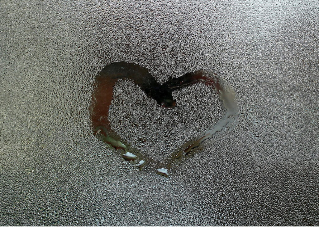 Heart drawn on a wet window